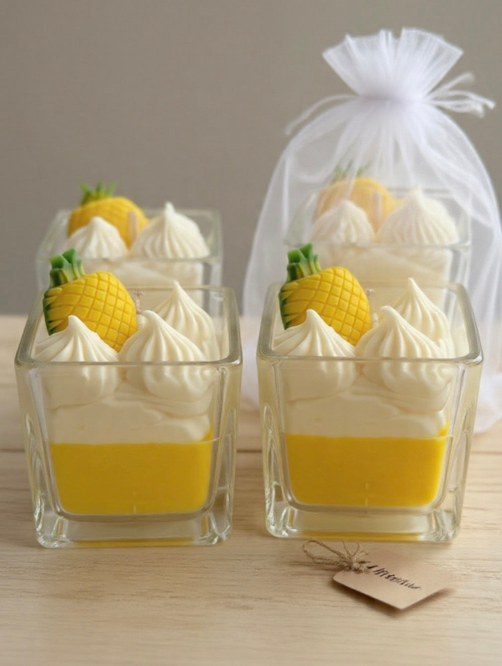 Multiple Pineapple Paradise Candles displayed with organza gift bag