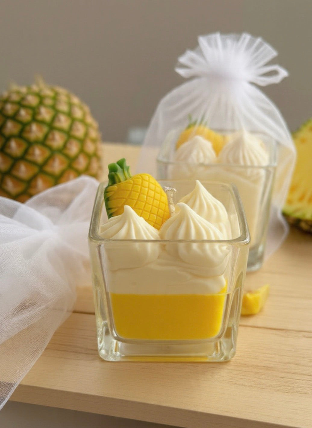 Pineapple Paradise Candle with whipped wax topping and pineapple decoration in organza bag