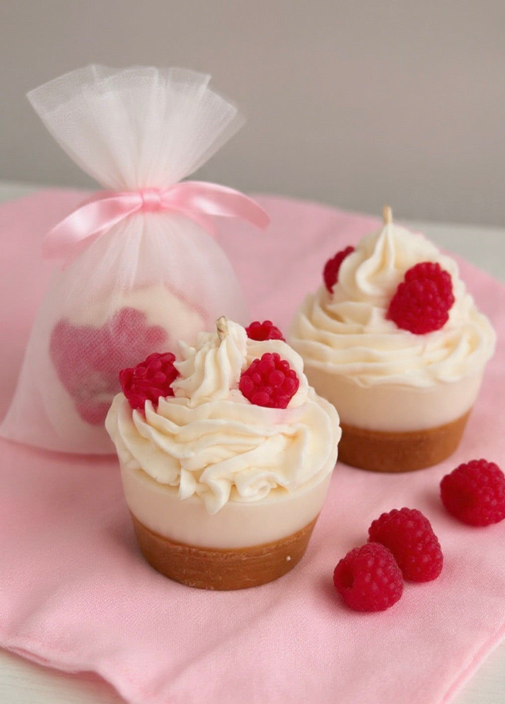 Raspberry Bliss Cake Candle on marble surface